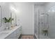 Modern bathroom featuring a glass-enclosed shower, double sink vanity, and elegant tile work for a spa-like experience at 5710 Barbary Coast Rd, Hollywood, SC 29449