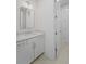 Powder room features a white vanity, countertop and modern mirror and light fixture at 5710 Barbary Coast Rd, Hollywood, SC 29449