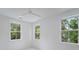Bedroom features a ceiling fan and large windows that provide natural light and views at 5710 Barbary Coast Rd, Hollywood, SC 29449