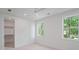 Bright bedroom with ample natural light, ceiling fan, walk-in closet and neutral color palette at 5710 Barbary Coast Rd, Hollywood, SC 29449