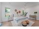 Serene main bedroom featuring a cozy bed, ambient lighting, and a minimalist decor, creating a peaceful atmosphere at 5710 Barbary Coast Rd, Hollywood, SC 29449
