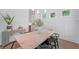 Bright dining area featuring a long wooden table, stylish decor, and a modern chandelier at 5710 Barbary Coast Rd, Hollywood, SC 29449