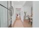Bright foyer with wood floors, white walls, and an open view into the dining and living spaces at 5710 Barbary Coast Rd, Hollywood, SC 29449