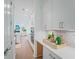 Modern kitchen with stainless appliances, white cabinets and countertops, and hardwood flooring at 5710 Barbary Coast Rd, Hollywood, SC 29449