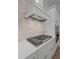 Close up of modern kitchen appliances, including a range hood, gas cooktop and built-in oven at 5710 Barbary Coast Rd, Hollywood, SC 29449