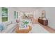 Bright and airy living room featuring a comfortable sofa, hardwood floors, and stylish decor at 5710 Barbary Coast Rd, Hollywood, SC 29449
