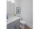 Stylish powder room featuring a modern vanity and a framed art print at 5710 Barbary Coast Rd, Hollywood, SC 29449