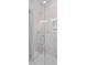 The frameless glass shower with herringbone floor tile is designed with sleek, modern elements at 5710 Barbary Coast Rd, Hollywood, SC 29449