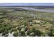 Overhead shot showing home among lush trees with river and marsh views at 633 Stono Edge Dr, Charleston, SC 29412
