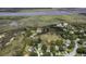 Aerial view highlighting a home location within a riverside marsh at 633 Stono Edge Dr, Charleston, SC 29412