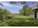 Expansive backyard with lush green grass and a charming wooden fence, perfect for outdoor activities at 633 Stono Edge Dr, Charleston, SC 29412