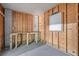 Partially finished basement area with workbench and wood-paneled walls at 633 Stono Edge Dr, Charleston, SC 29412
