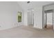 Bedroom features large window and a view to the hallway and closet at 633 Stono Edge Dr, Charleston, SC 29412