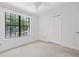 This bedroom has a large window letting in natural light and a double door closet at 633 Stono Edge Dr, Charleston, SC 29412