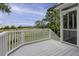 Enjoy serene outdoor living on this deck with white railings and beautiful views of marsh and trees at 633 Stono Edge Dr, Charleston, SC 29412