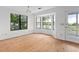 Sun-filled dining area featuring hardwood floors, a bay window, and access to the outdoor porch at 633 Stono Edge Dr, Charleston, SC 29412