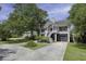 Charming home with well-manicured landscaping, driveway, and covered porch exuding curb appeal at 633 Stono Edge Dr, Charleston, SC 29412
