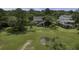 Scenic view of an elevated home nestled among trees near tranquil wetlands at 633 Stono Edge Dr, Charleston, SC 29412