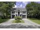Charming two-story home with symmetrical design, well-maintained landscaping and double garage, offering curb appeal at 633 Stono Edge Dr, Charleston, SC 29412