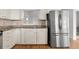 Kitchen with stainless refrigerator, granite countertop and view to another room at 633 Stono Edge Dr, Charleston, SC 29412