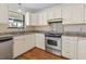 Updated kitchen features stainless steel appliances and granite countertops at 633 Stono Edge Dr, Charleston, SC 29412
