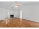 Bright living room featuring hardwood floors, a cozy fireplace and large windows for natural light at 633 Stono Edge Dr, Charleston, SC 29412