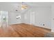 Spacious living room with gleaming hardwood floors, offering a view into the bright, updated kitchen at 633 Stono Edge Dr, Charleston, SC 29412