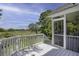Inviting screened porch overlooking a lush landscape, offering a tranquil outdoor living space at 633 Stono Edge Dr, Charleston, SC 29412