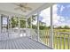 Inviting screened porch with ceiling fan offers tranquil views of the lush landscape and scenic surroundings at 633 Stono Edge Dr, Charleston, SC 29412