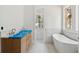 Stylish bathroom with wood vanity, standalone tub, and bright natural light at 743 Hills St, Mount Pleasant, SC 29464