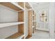 Unfinished custom closet with blond wood shelving and bright natural light at 743 Hills St, Mount Pleasant, SC 29464