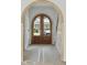 View through arched doorway featuring wood double doors at 743 Hills St, Mount Pleasant, SC 29464