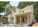 Spacious home exterior with a pool, covered patio, and lush greenery, offering a perfect blend of indoor-outdoor living at 743 Hills St, Mount Pleasant, SC 29464