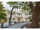 Charming two-story home with gray gravel driveway and mature trees at 743 Hills St, Mount Pleasant, SC 29464