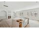 Spacious living room showcasing a fireplace, large windows, and white kitchen island at 743 Hills St, Mount Pleasant, SC 29464