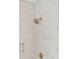 Shower features new shower head, neutral tile, and a built-in niche for storage providing a spa-like experience at 743 Hills St, Mount Pleasant, SC 29464