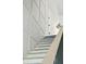 Elegant staircase with white trim and modern paneled wall detail offers a bright and stylish transition between floors at 743 Hills St, Mount Pleasant, SC 29464