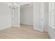 Elegant dining room with wainscoting, light wood floors, and glass-paneled doors at 791 Maynard Ln, Summerville, SC 29486