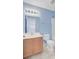 Light blue bathroom featuring a single sink vanity, mirror, and shower-tub combo at 810 Bibury Ct, Charleston, SC 29414