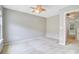 Neutral bedroom featuring a ceiling fan, soft carpet, and light-filled doorway at 810 Bibury Ct, Charleston, SC 29414
