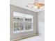 Bedroom featuring ceiling fan and a large window view of the neighborhood at 810 Bibury Ct, Charleston, SC 29414