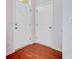 Bright entryway with hardwood floors, white trim, and dual front doors for added privacy at 810 Bibury Ct, Charleston, SC 29414