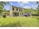 Exterior view showing the screened porch and large yard at 810 Bibury Ct, Charleston, SC 29414