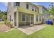 Exterior view showing the screened porch and patio at 810 Bibury Ct, Charleston, SC 29414