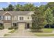 Charming townhome with a well-manicured lawn, lovely landscaping, and a traditional facade at 810 Bibury Ct, Charleston, SC 29414