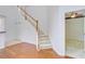 Bright foyer with hardwood floors and staircase leading to the upper level at 810 Bibury Ct, Charleston, SC 29414