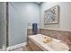 Soaking tub in a modern bathroom with a shower and decorative mirror at 8327 Childs Cove Cir, North Charleston, SC 29418