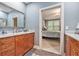 Bathroom featuring marble countertops, wood cabinets, and an entry to the main bedroom at 8327 Childs Cove Cir, North Charleston, SC 29418