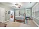 Bright bedroom with a four-poster bed and two windows overlooking the yard at 8327 Childs Cove Cir, North Charleston, SC 29418