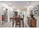 Open-concept dining room flows seamlessly into the kitchen at 8327 Childs Cove Cir, North Charleston, SC 29418